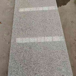 锦州芝麻白光面毛板